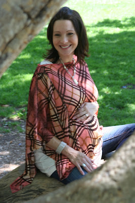 Dria nursing cover - stylish and multifunctional fashion poncho/nursing cover for moms, also doubles as a nursing cover and car seat or stroller cover.