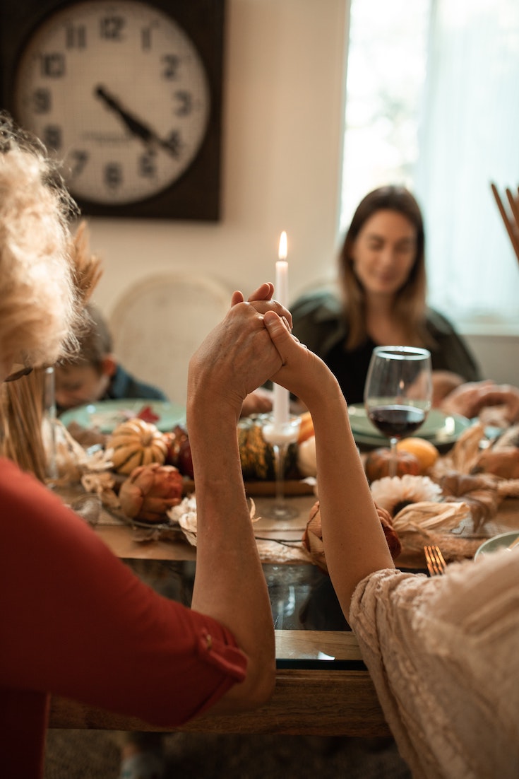 Family meditating before a meal