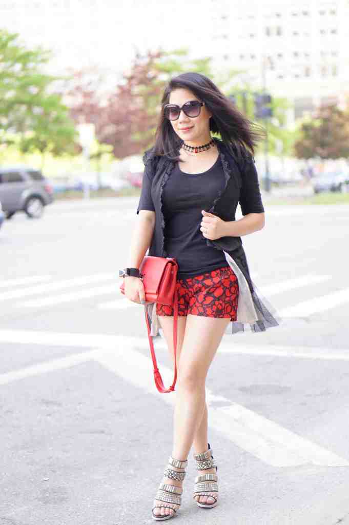 Grace's outfit red shorts and black top