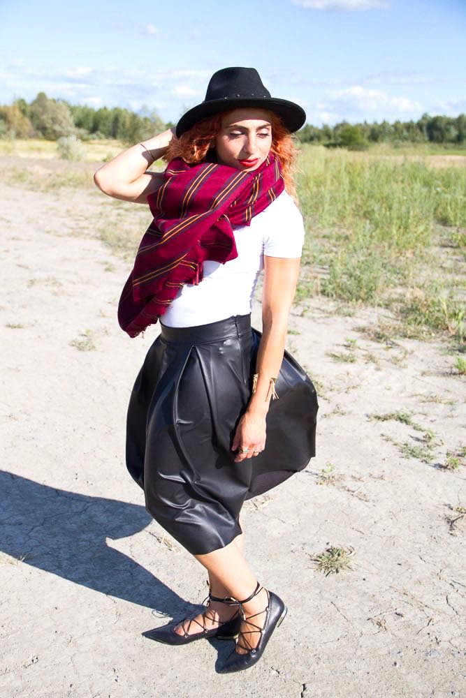 Black leather skirt, white top, black hat, wrap ballerina flats and blanket scarf