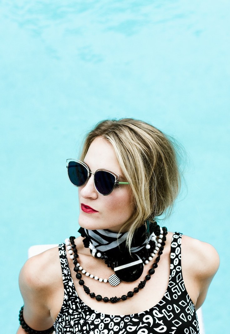 Girl wearing funky outfit and sunglasses