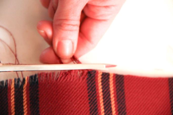Blanket scarf cutting excess off frayed edges