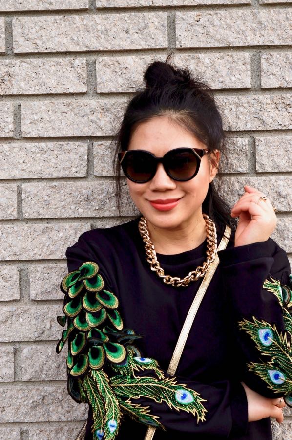 Peacock sweater in black, green and blue