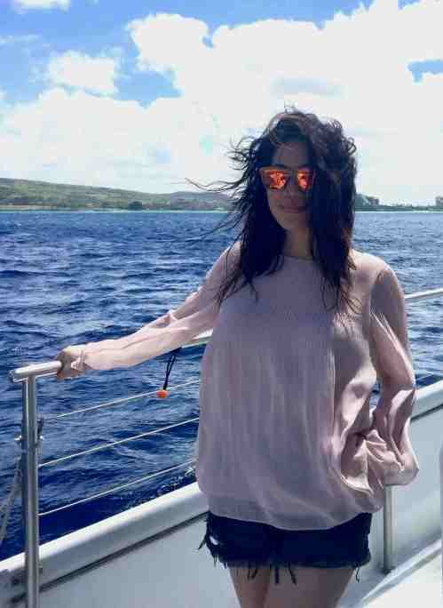 Pink top with frayed denim shorts