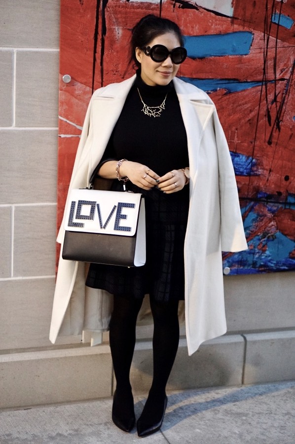 Grace in white coat with black heels