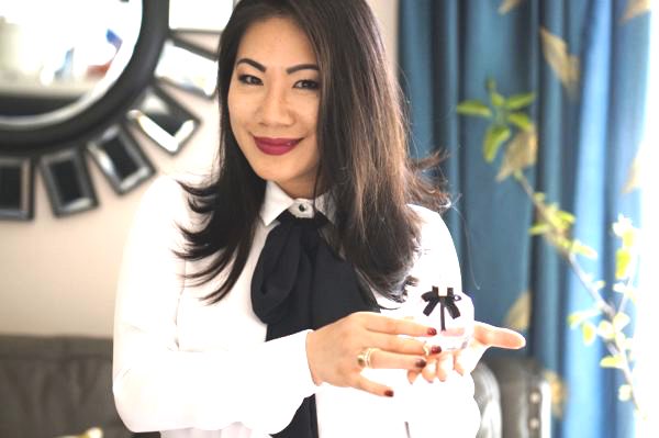 Grace in white shirt with black jabot