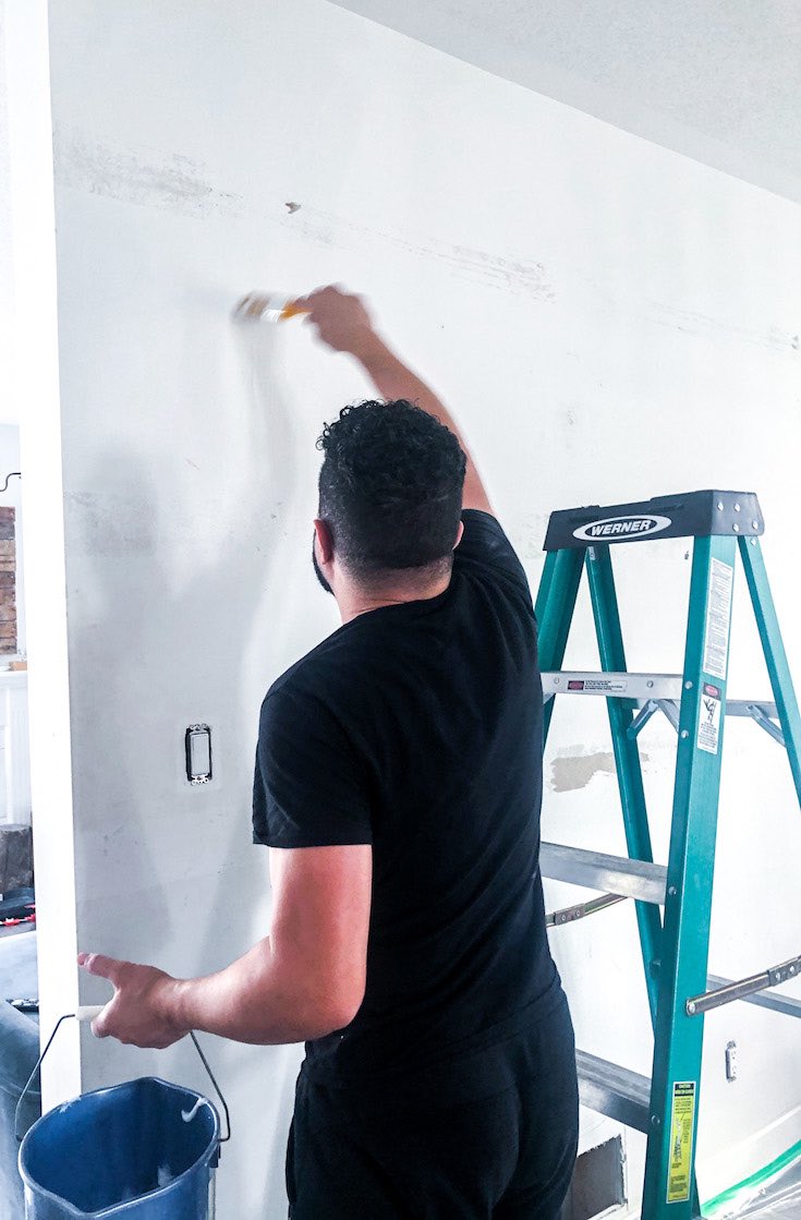 Applying glue on wall