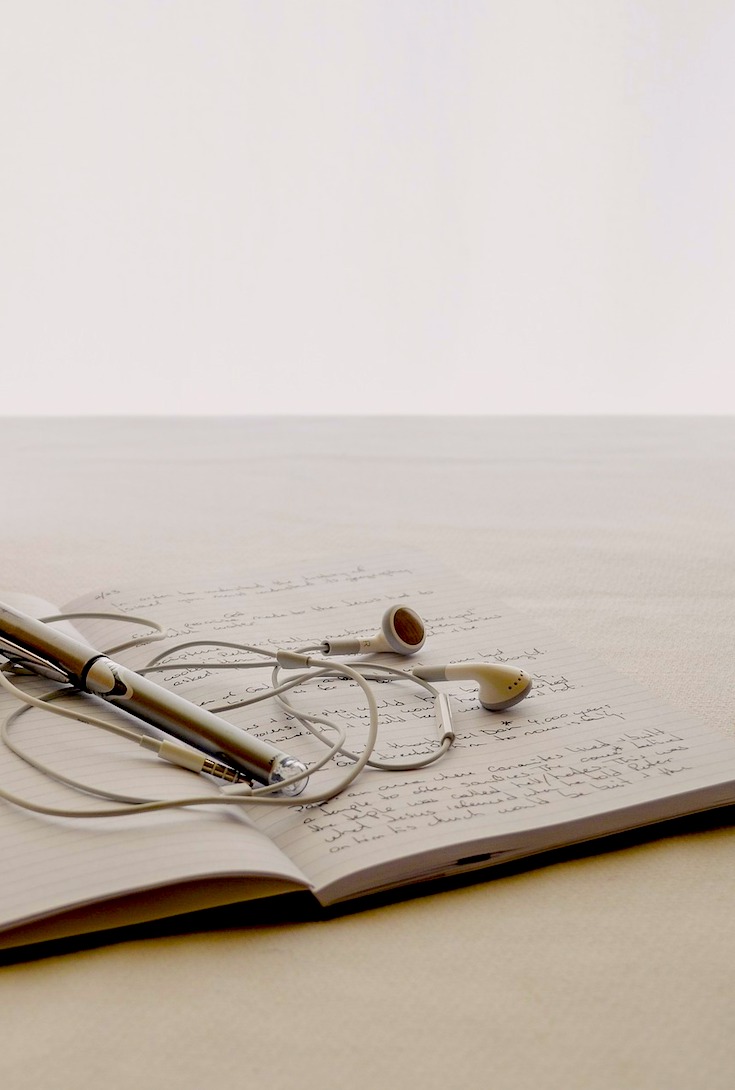 Journal writing, earphones
