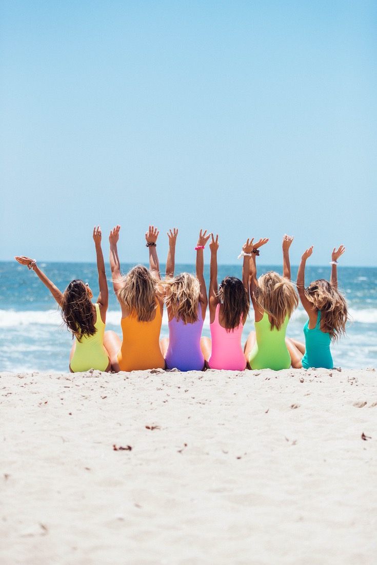 Back view of girls on a beach