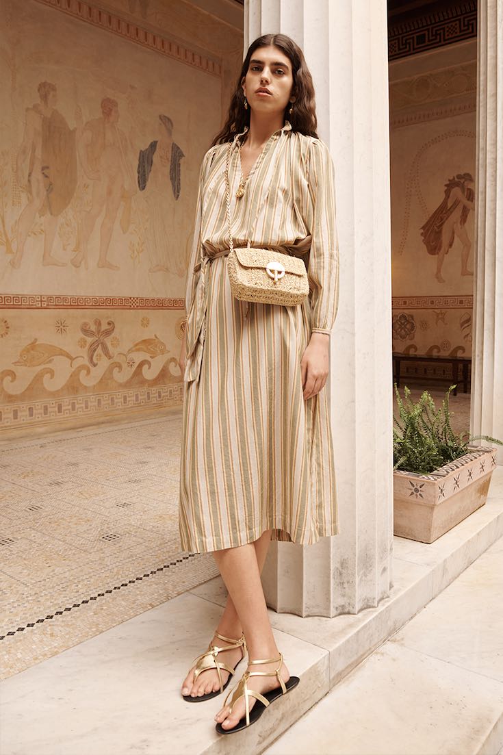 Woman in striped beige dress