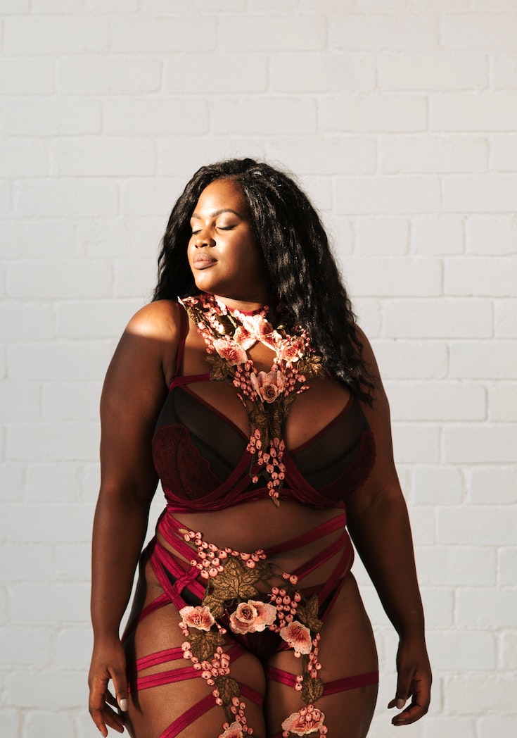 Woman in lingerie with flower arrangement