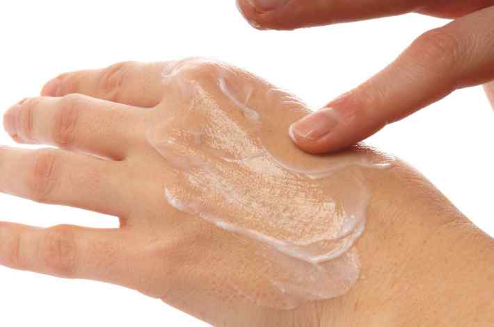 Putting lotion on hands