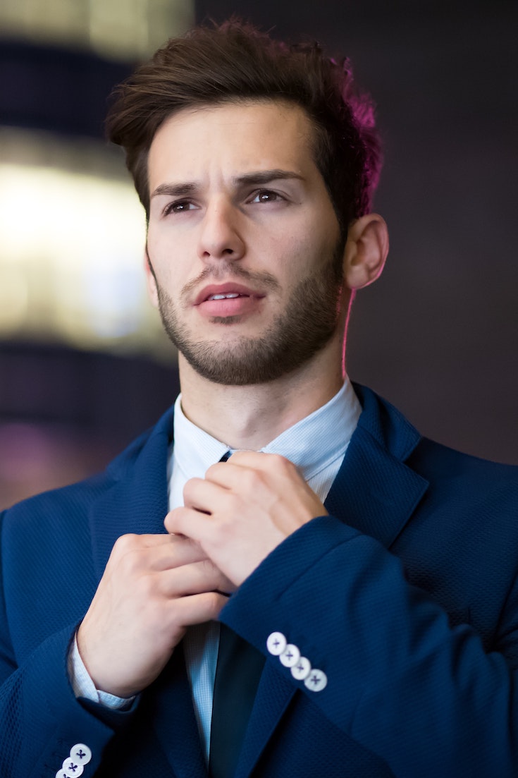 Man in blue suit, hair loss treatment