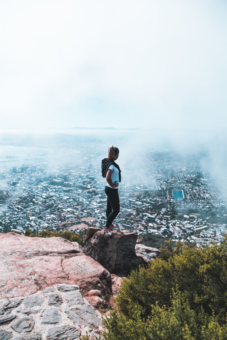 Woman hiking at top of mountain