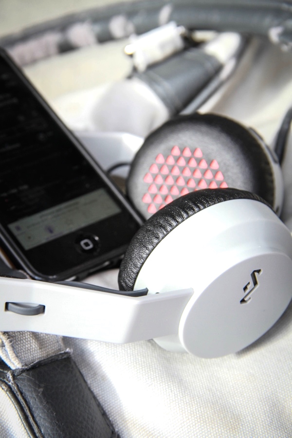 House of Marley Rebel headphones plugged into phone