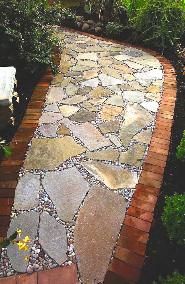 Flagstone pathway with brick in backyard
