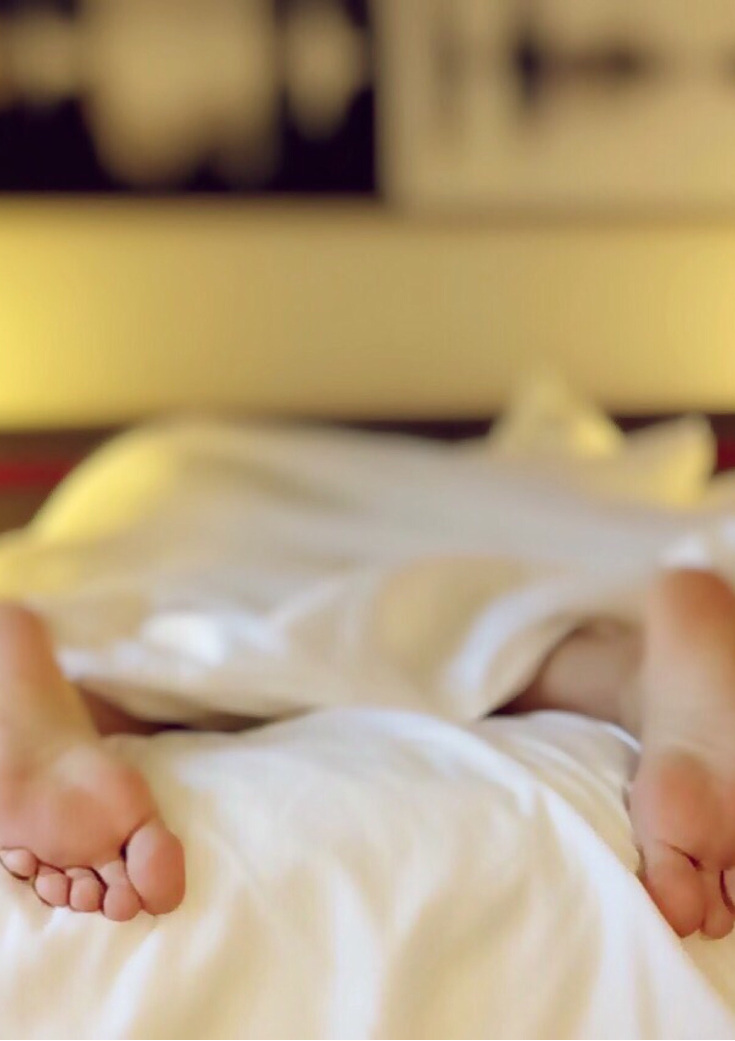 Feet outside cover on mattress