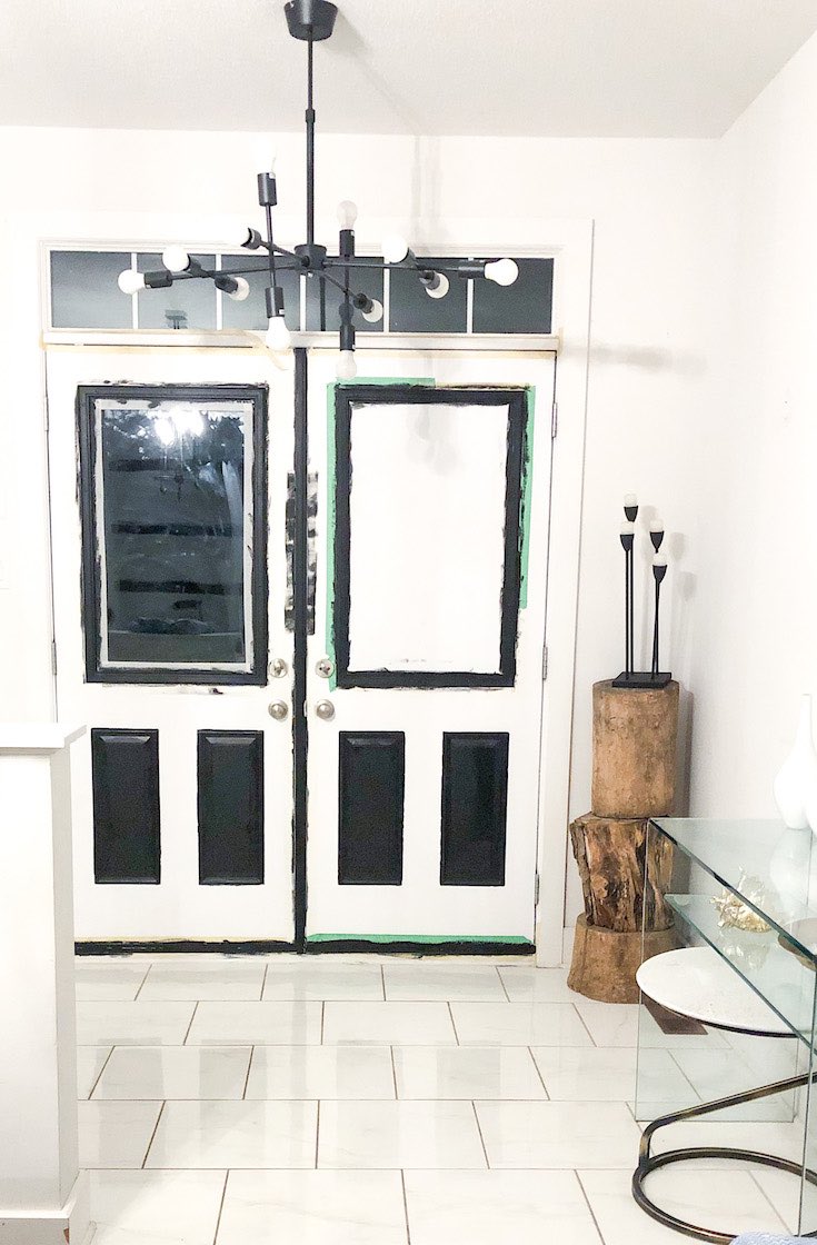 Black and white door with black panels