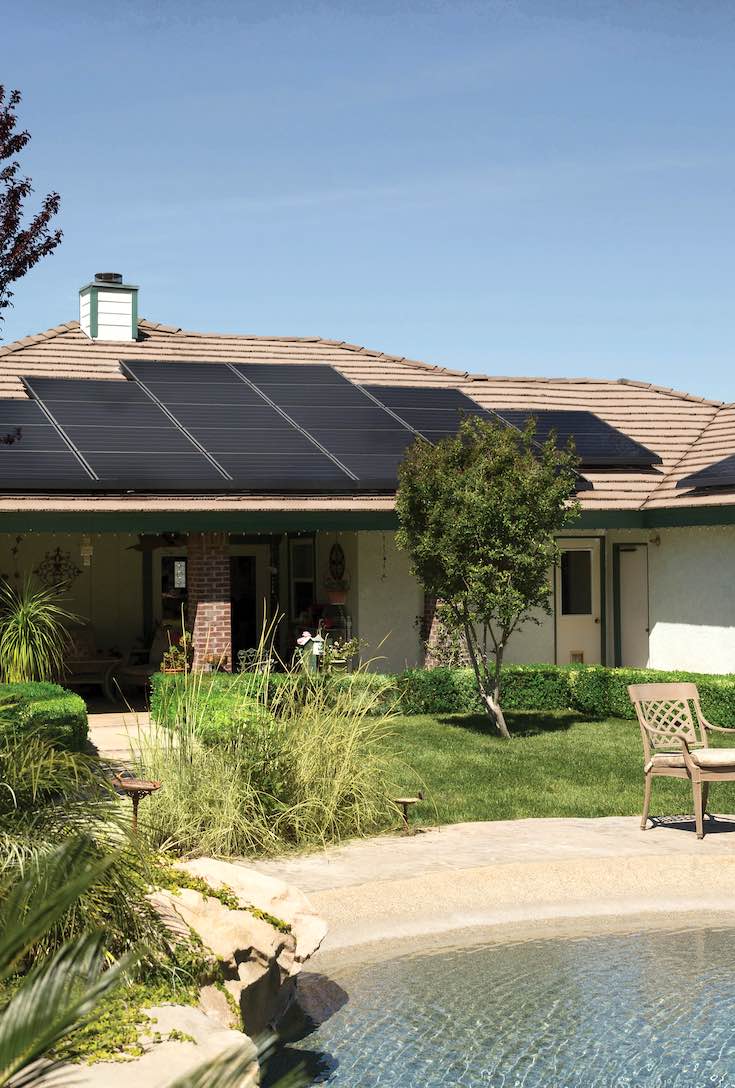 Black solar panels on brown roof