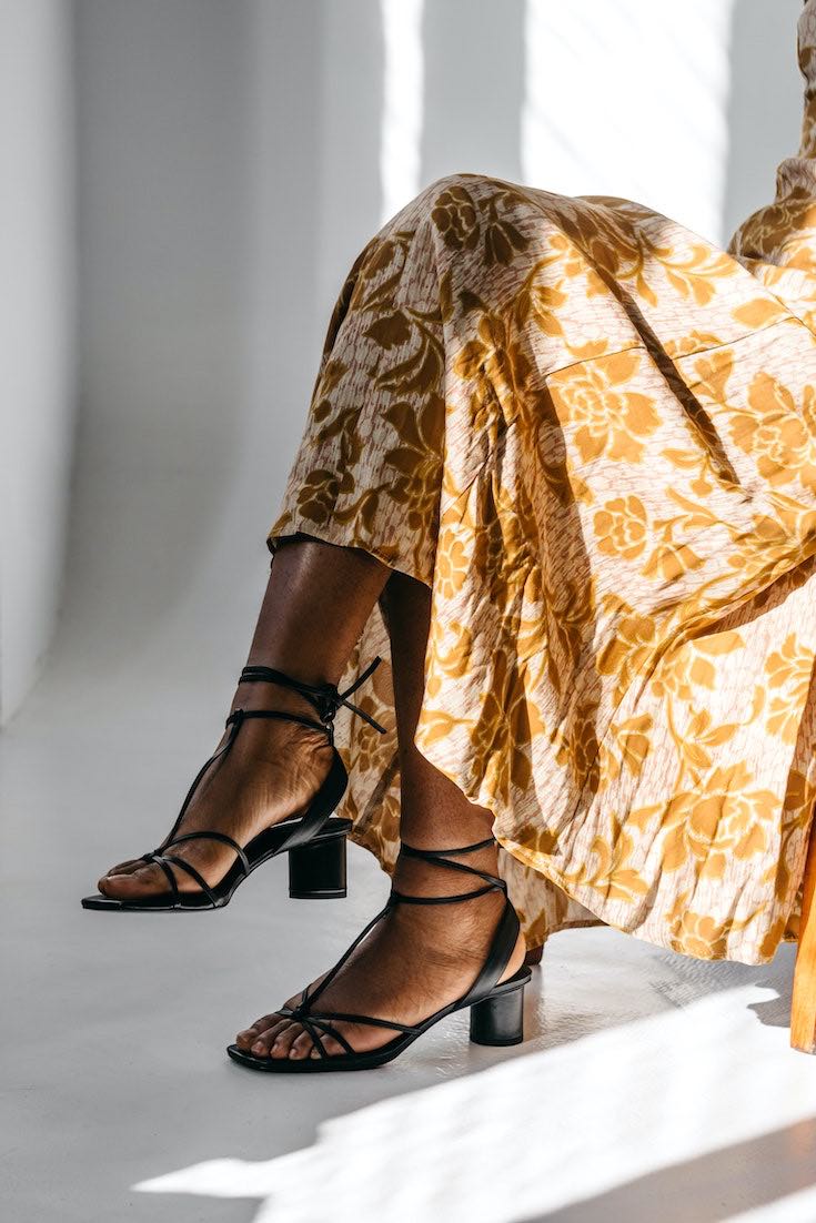 Woman in floral dress and slingback shoes