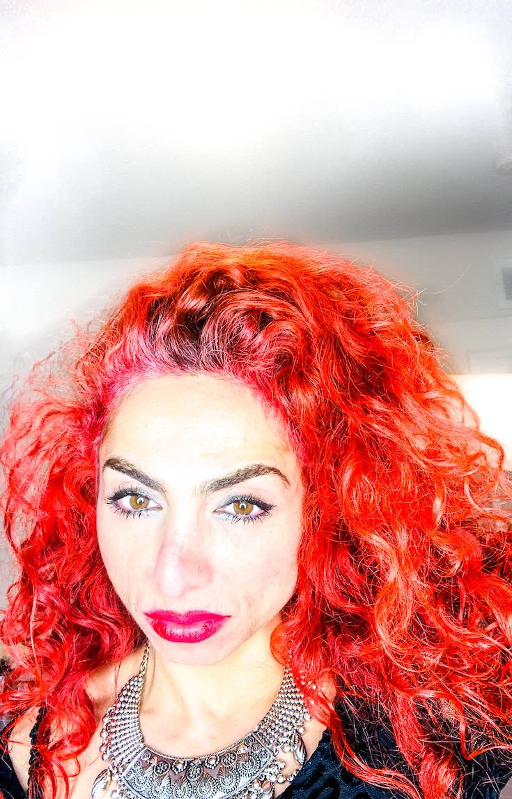 Red curly hair colour tube and developer