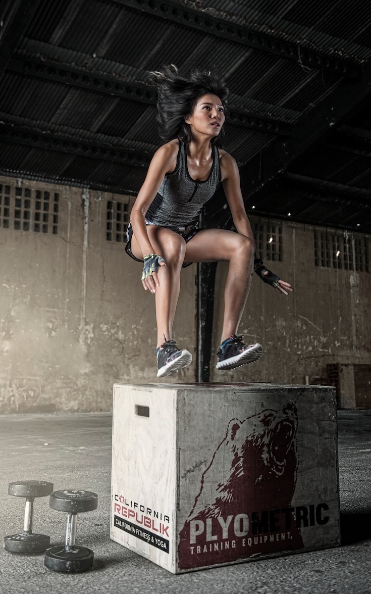 Woman doing box jump