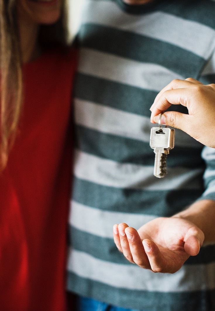 Couple getting keys for their new home