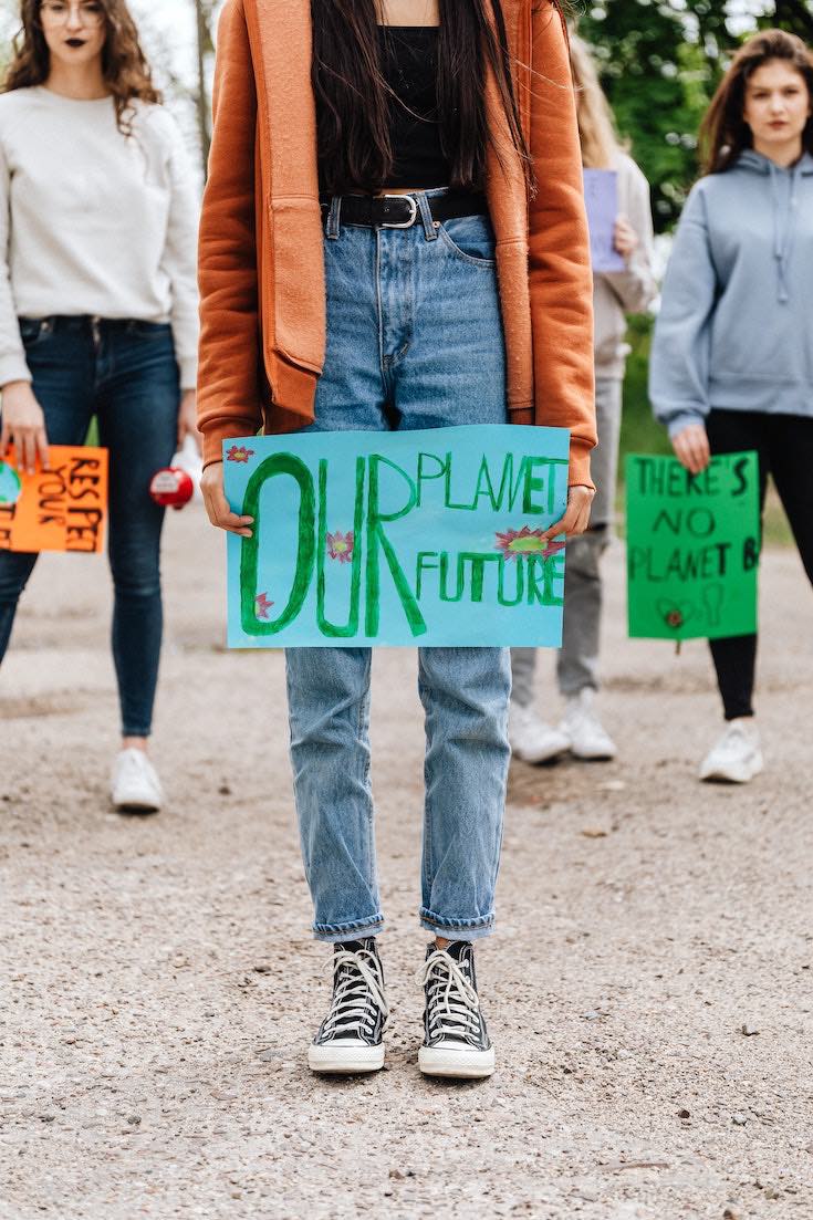 Girl holding Save our Planet sign